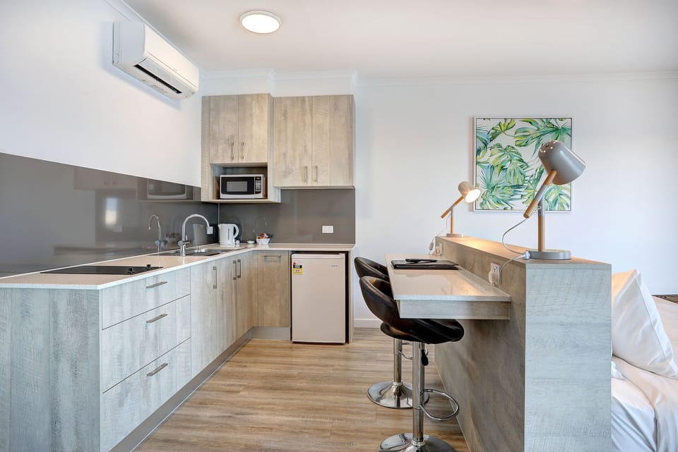 Luxury Studio, 1 King Bed, Jetted Tub, Sea View | Private kitchenette | Fridge, microwave, electric kettle, toaster