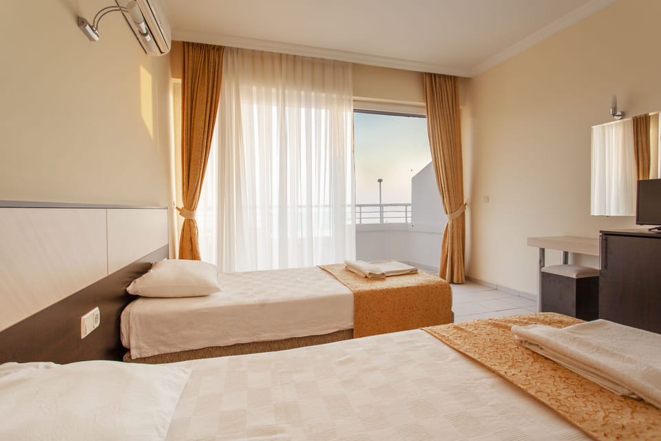 Standard Double or Twin Room, Sea View | Minibar, in-room safe, desk, soundproofing