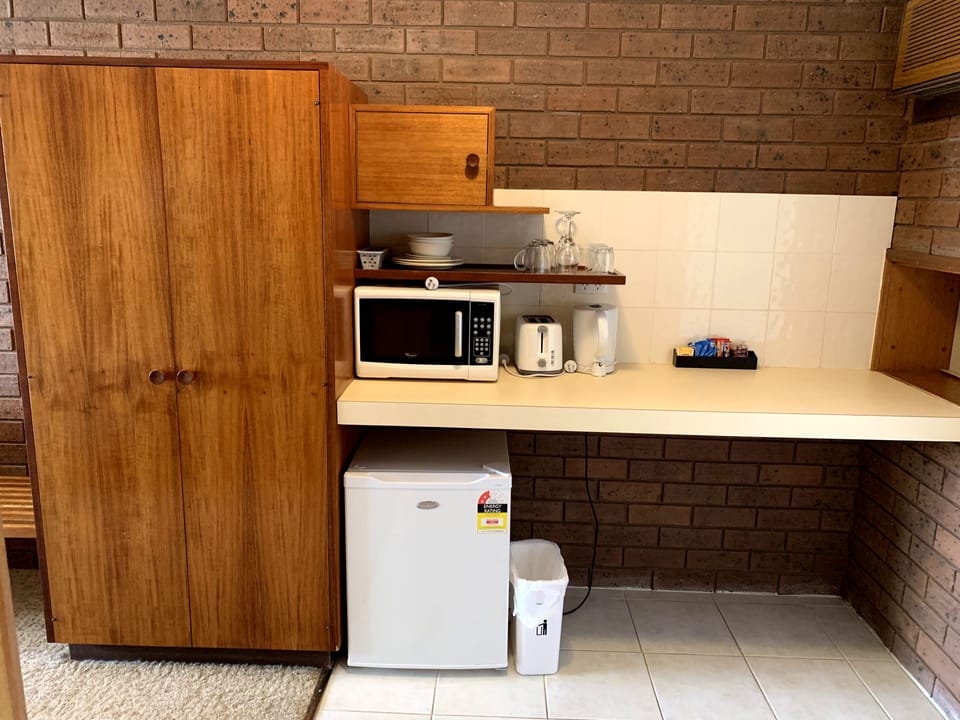 Standard Triple Room | Minibar, desk, laptop workspace, blackout drapes