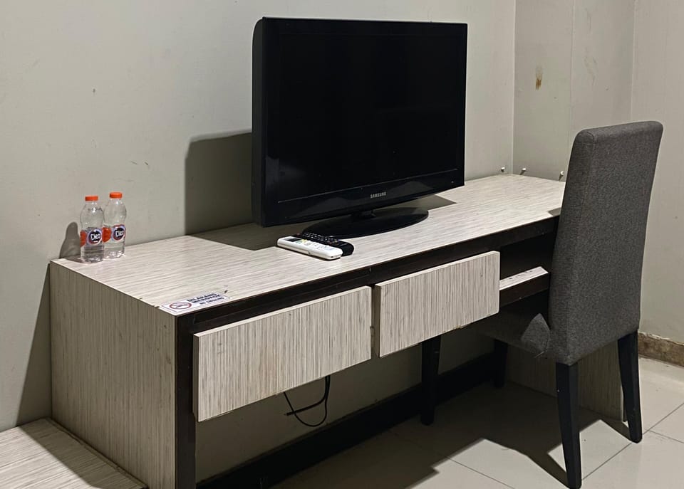 Desk, laptop workspace, blackout drapes, bed sheets