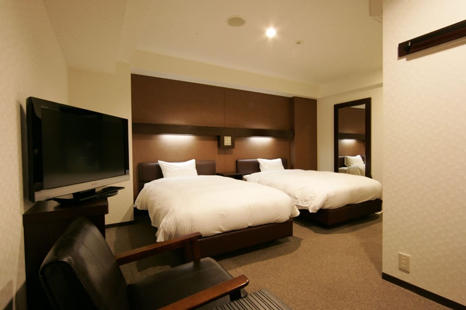 Down comforters, desk, blackout drapes, WiFi (free)
