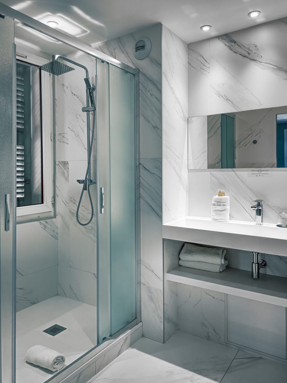 Shower, eco-friendly toiletries, hair dryer, towels