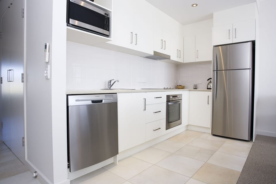 Two Bedroom Apartment | Private kitchen | Fridge, coffee/tea maker, electric kettle, cookware/dishes/utensils
