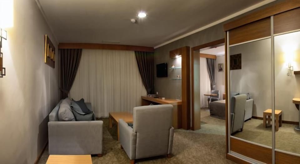 Suite, 1 Bedroom | Living area | LCD TV