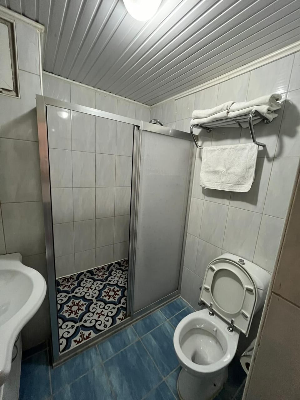 Shower, free toiletries, hair dryer, slippers
