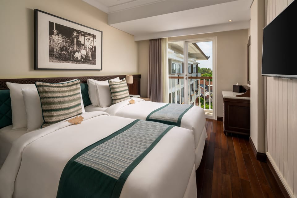 Magnolia Suite | Premium bedding, down comforters, Select Comfort beds, minibar
