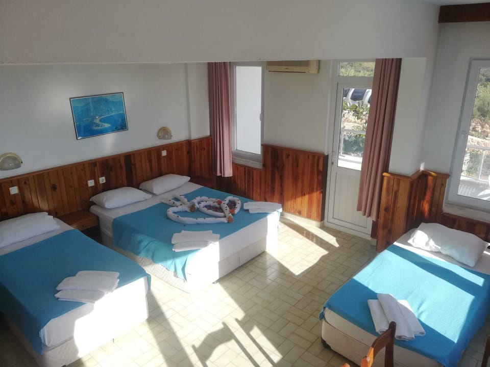 Family Room, Sea View | Desk, laptop workspace, free WiFi, bed sheets