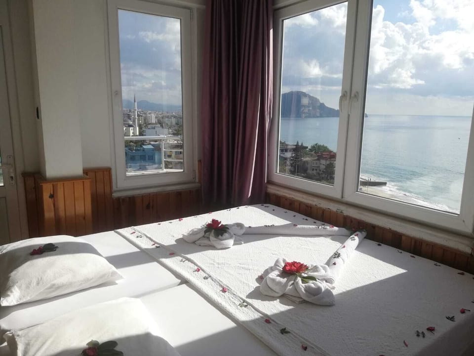 Family Room, Sea View | Desk, laptop workspace, free WiFi, bed sheets
