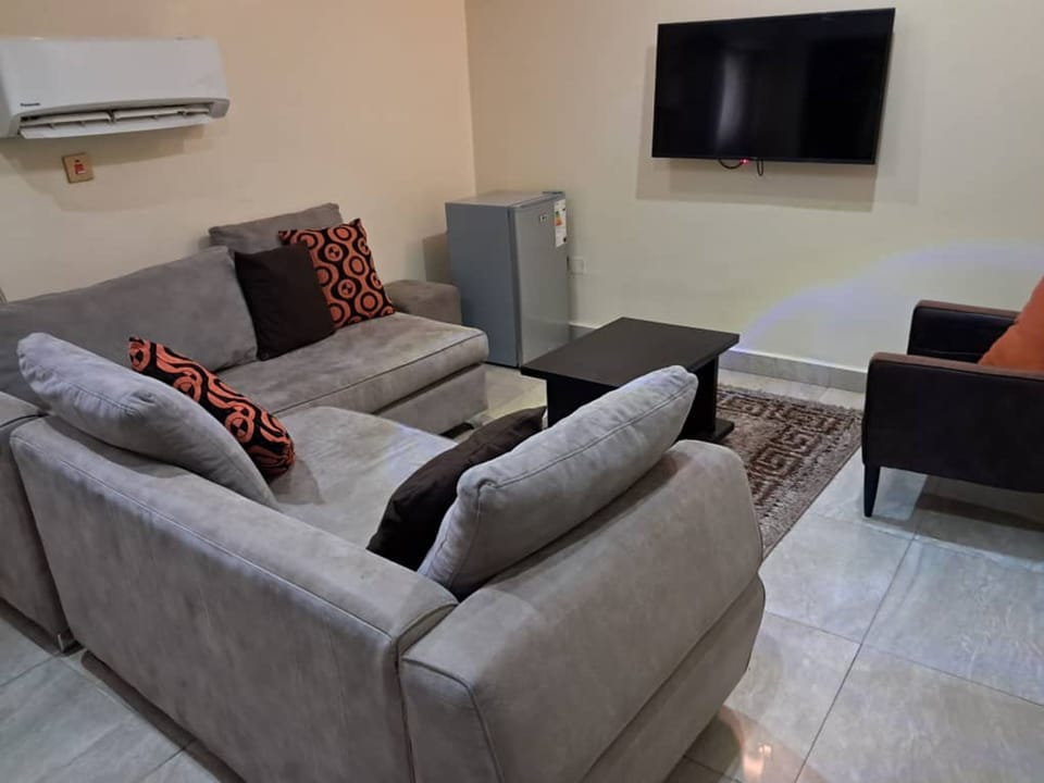 Suite, 1 Bedroom | Living area | Flat-screen TV