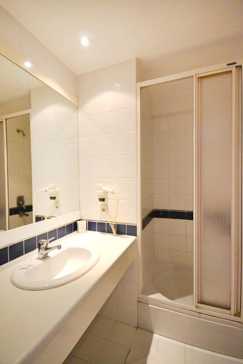 Shower, free toiletries, hair dryer, slippers
