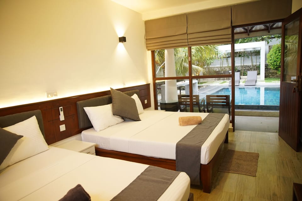 Family Villa, Pool View | Minibar, in-room safe, laptop workspace, soundproofing