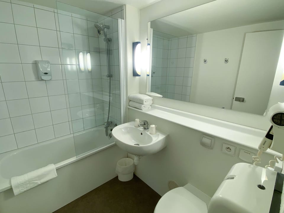 Eco-friendly toiletries, hair dryer, towels