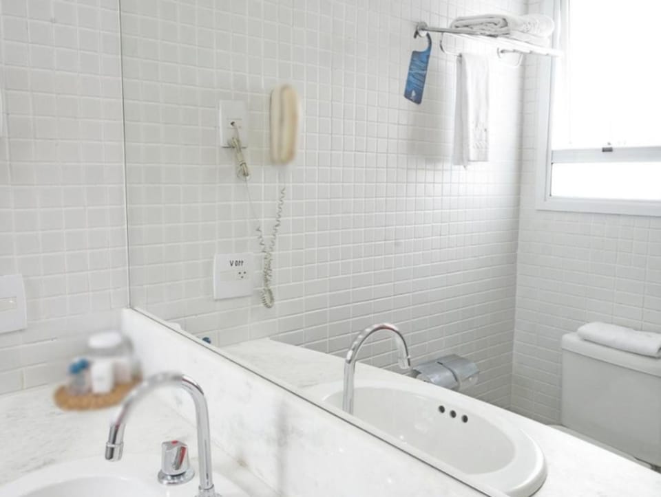 Shower, designer toiletries, hair dryer, towels