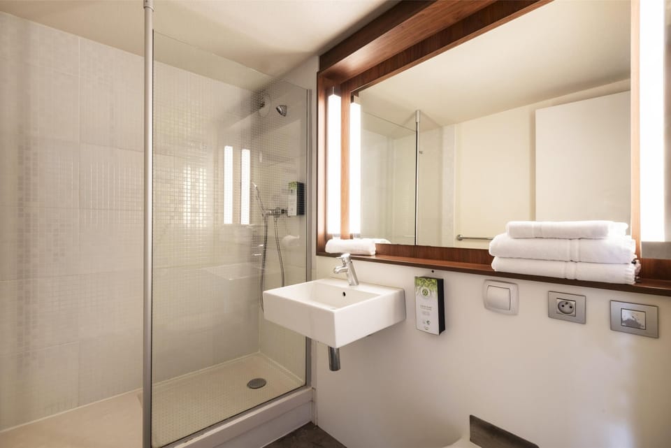 Shower, eco-friendly toiletries, hair dryer, towels