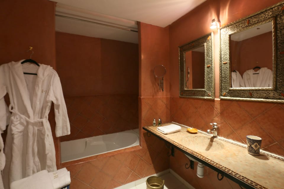 Bathroom | Hair dryer, bathrobes, slippers, towels