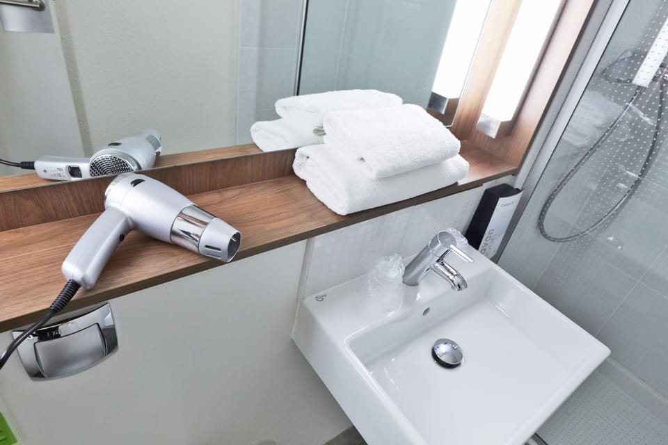 Eco-friendly toiletries, hair dryer, towels, soap
