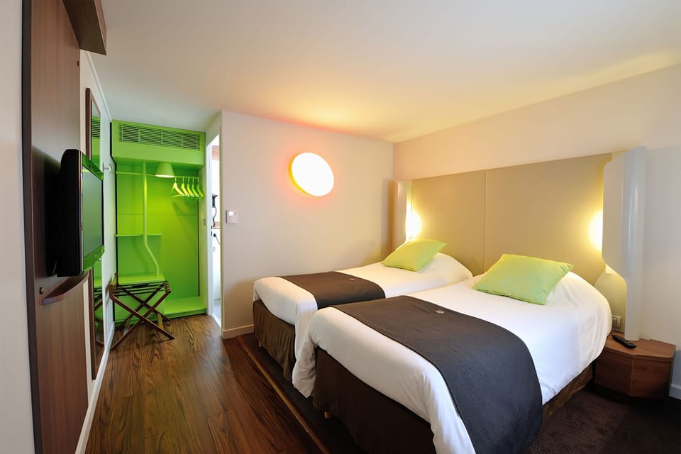 Premium bedding, desk, laptop workspace, blackout drapes