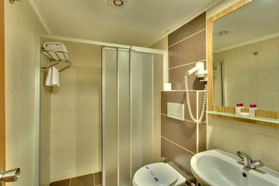 Shower, free toiletries, hair dryer, slippers