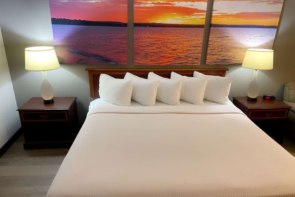 Desk, laptop workspace, iron/ironing board, free cribs/infant beds