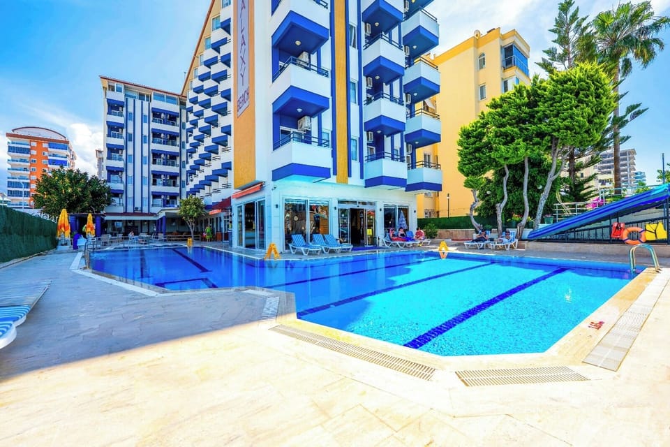 Outdoor pool, open 8:30 AM to 7:00 PM, pool umbrellas, sun loungers
