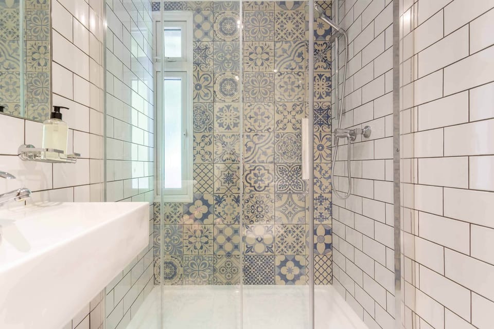 Lower ground floor quad room with shared bathroom | Bathroom | Shower, hair dryer, towels