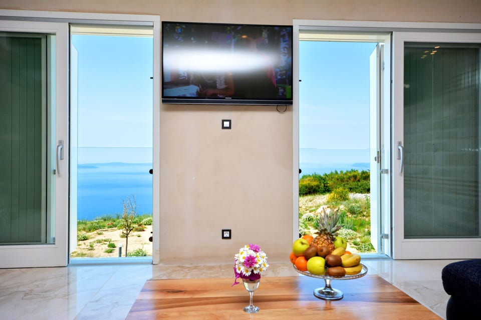 Luxury Villa, Multiple Bedrooms, Terrace, Ocean View | Living room | Flat-screen TV
