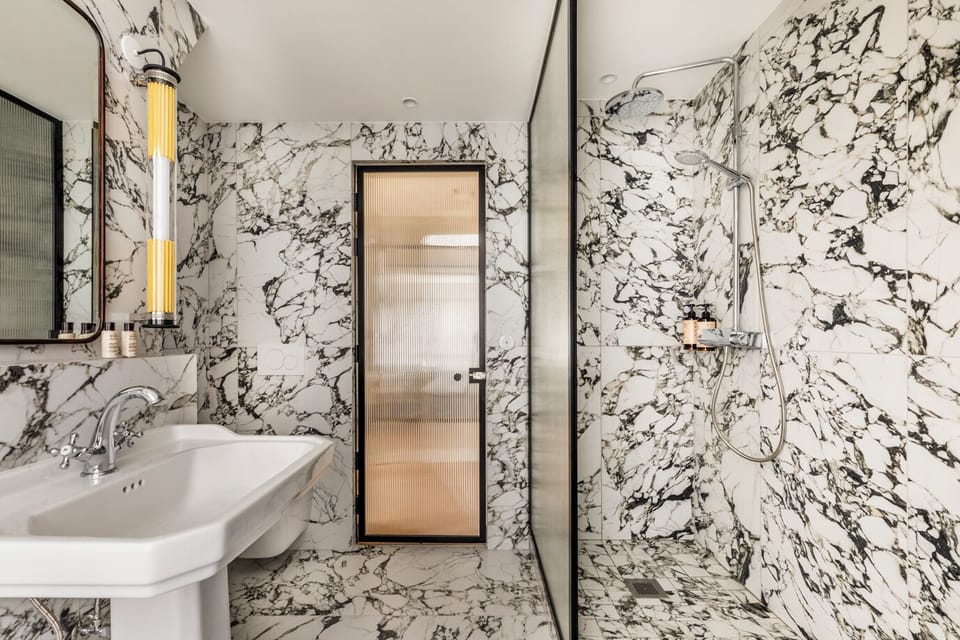 Following the roofs of Paris | Bathroom | Shower, rainfall showerhead, designer toiletries, hair dryer