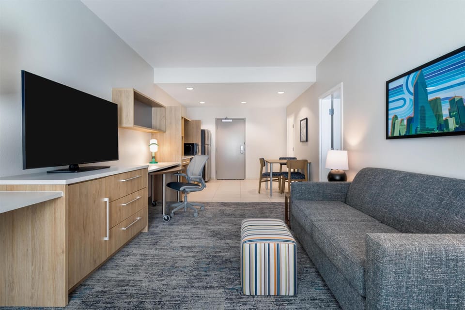 Suite, 1 King Bed, Accessible, Non Smoking (mob/hearing acc w/ roll-in shower) | Living area | 55-inch flat-screen TV with digital channels, TV, streaming services