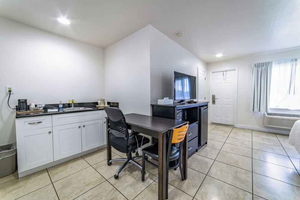 Standard Room, 2 Queen Beds, Refrigerator & Microwave, Ground Floor | 2 bedrooms, down comforters, desk, laptop workspace