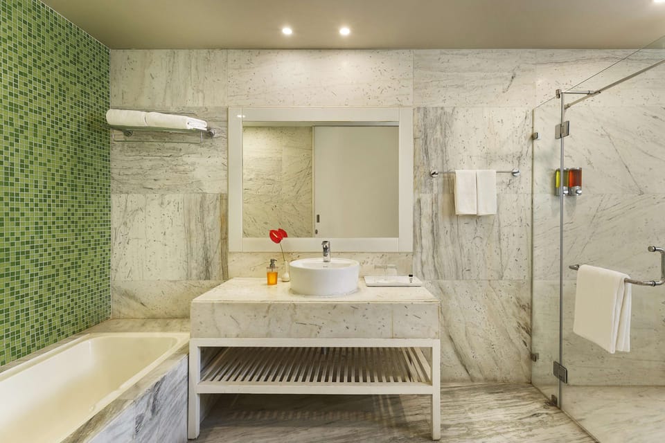 Separate tub and shower, rainfall showerhead, free toiletries