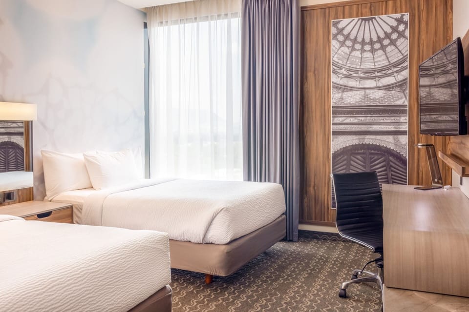 Room, 2 Double Beds | In-room safe, desk, blackout drapes, soundproofing