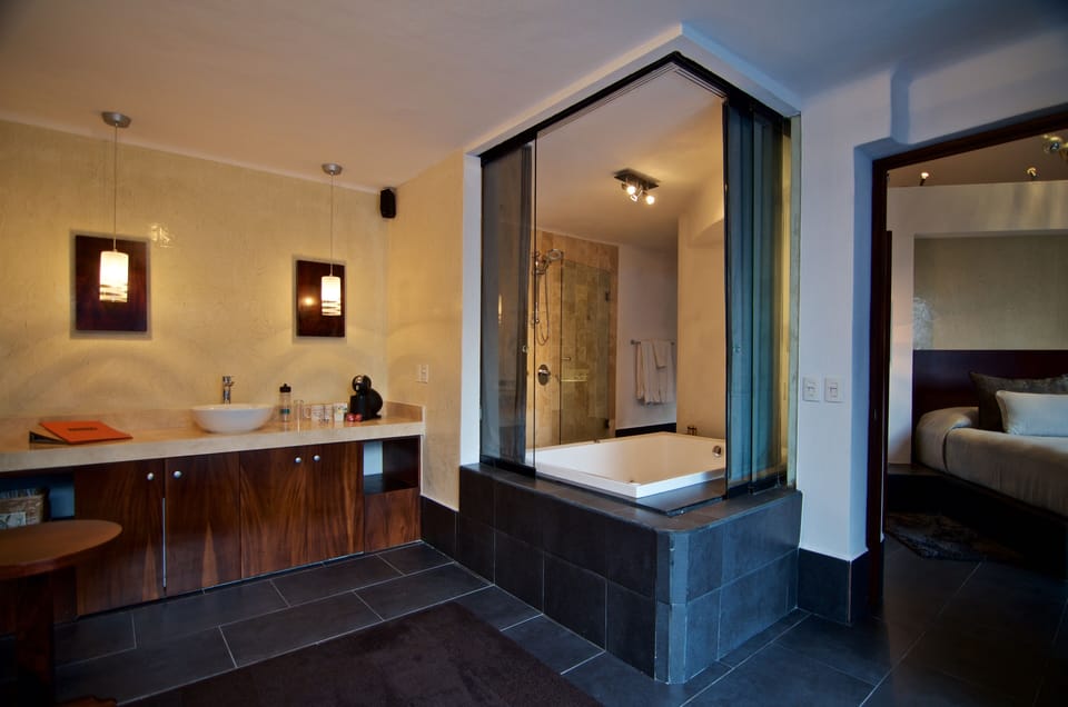 Frida Suite | Bathroom | Shower, rainfall showerhead, free toiletries, hair dryer