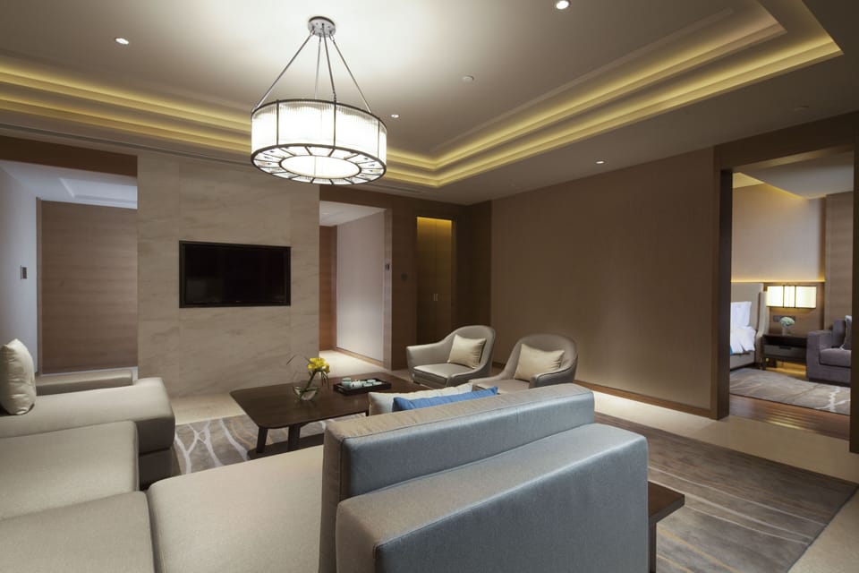 1 King 1 Bedroom Premier Club Suite Living Area Lake View | Premium bedding, free WiFi, bed sheets