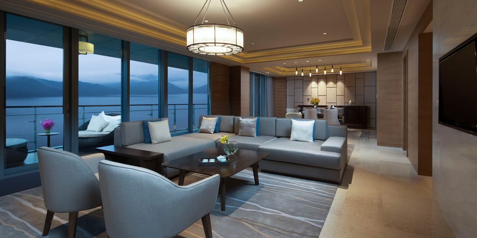 1 King 1 Bedroom Premier Club Suite Living Area Lake View | Premium bedding, free WiFi, bed sheets