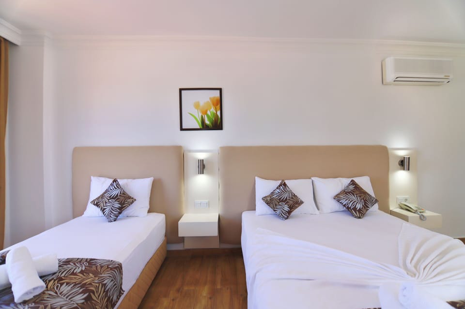 Family Room, Pool View | Minibar, in-room safe, iron/ironing board, free WiFi
