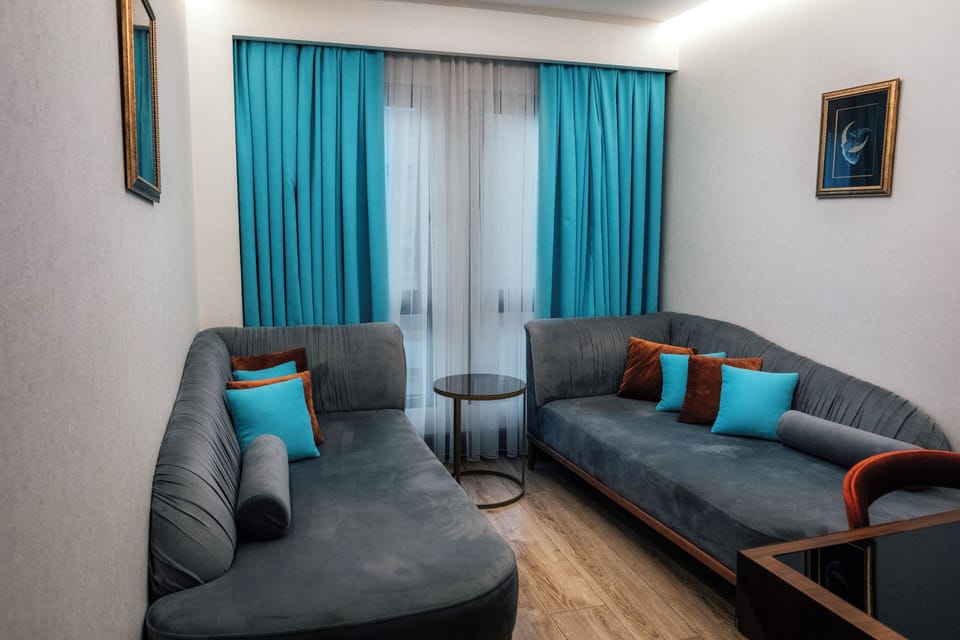 Family Studio Suite, Sea View | Living room | 40-inch LED TV with satellite channels, TV