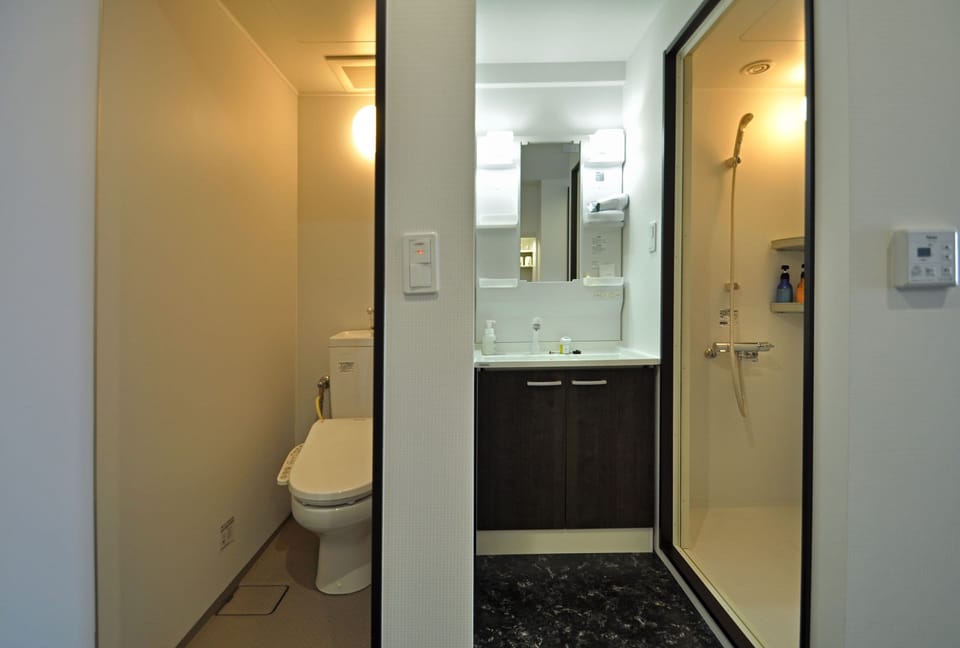 Shower, free toiletries, hair dryer, slippers