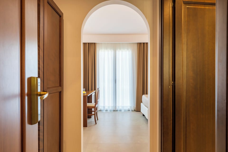 Double or Twin Room | Minibar, in-room safe, desk, blackout drapes