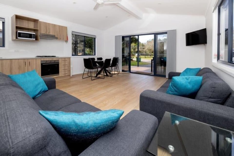 Deluxe Balcony 3 Bedroom Villa | Living area | Flat-screen TV, table tennis, books