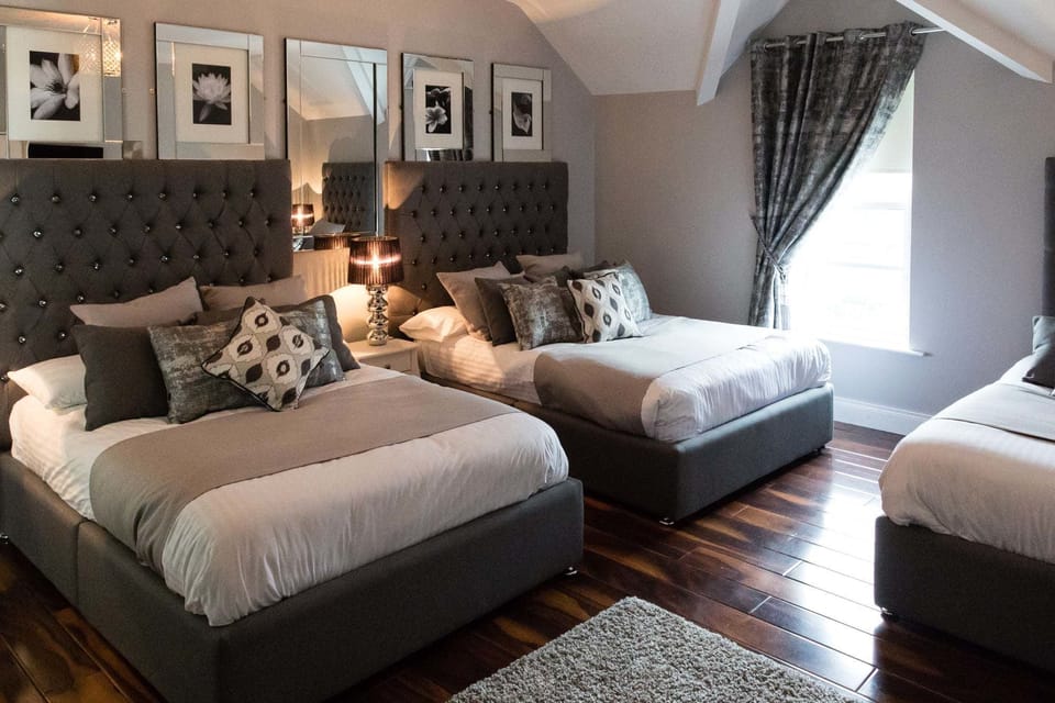 Family Room | Premium bedding, down comforters, individually decorated