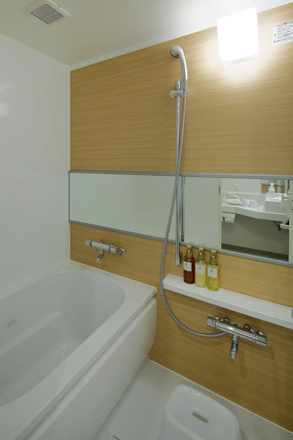 Eco-friendly toiletries, hair dryer, slippers, bidet