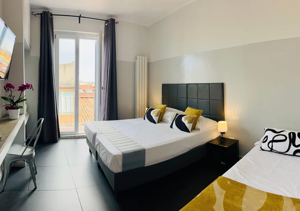 Triple Room, Balcony | Minibar, in-room safe, desk, soundproofing