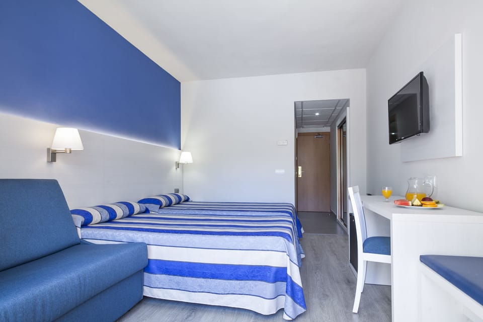 Triple Room (2 Adults + 1 Child) | In-room safe, desk, free WiFi, bed sheets