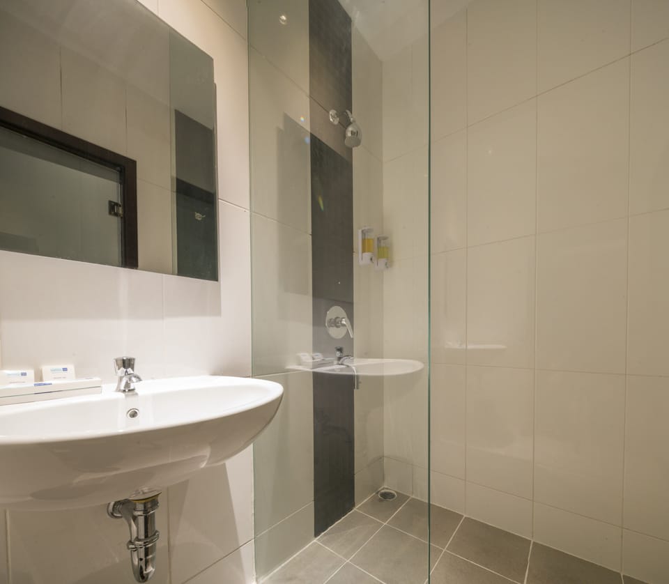 Shower, hair dryer, slippers, towels
