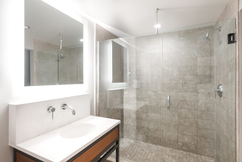 Combined shower/tub, designer toiletries, hair dryer, bathrobes