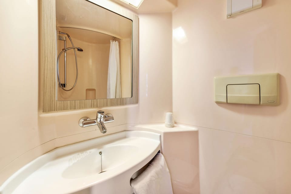 Shower, eco-friendly toiletries, towels, soap