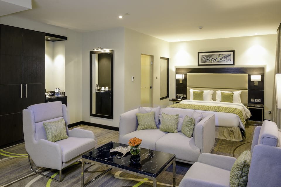 Executive Room, 1 King Bed | Living area | 43-inch LCD TV with cable channels, TV