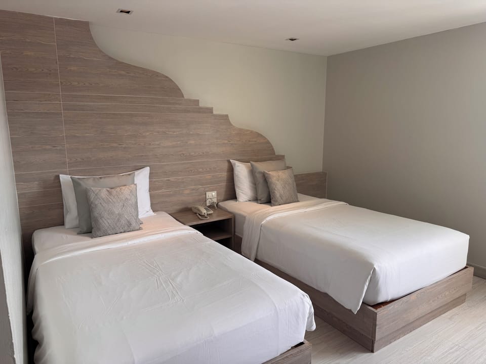 Standard Twin Room | Free minibar items, in-room safe, desk, blackout drapes