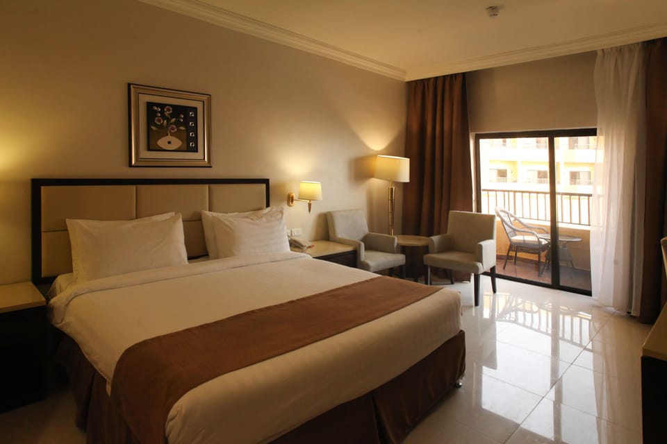 Deluxe Double Room, Pool View, Poolside | 1 bedroom, minibar, in-room safe, iron/ironing board (on request)