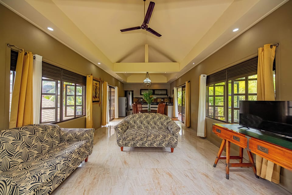 Apartment, 1 King Bed, Sea View, Beachfront | Living area | 40-inch LED TV with cable channels, TV